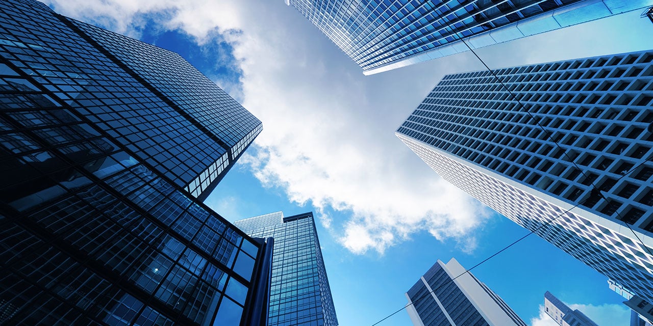 View of tall office building look up from the ground.