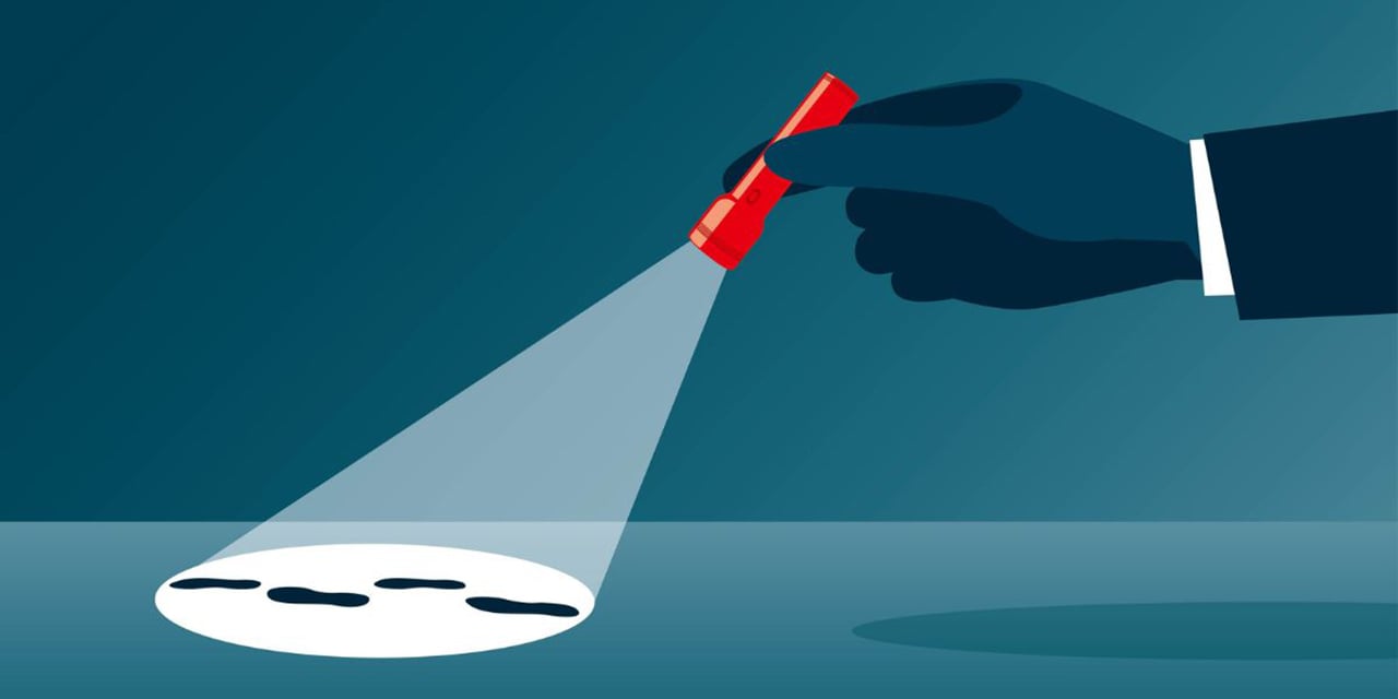 Cartoon of a hand holding a flashlight with footprints in the glow of the light.